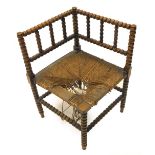 A late 19thC beech bobbin turned corner chair, with rattan seat. (AF)