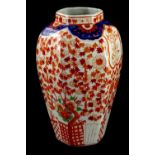 A Japanese Imari octagonal vase, decorated with flowers, leaves etc., 32cm H.