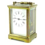 An early 20thC French brass carriage timepiece, with white enamel dial, 13cm H.