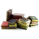 A collection of books, to include volume I of Hooker's Works, various postcards etc.