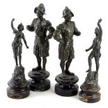 Two pairs of 19thC spelter figurines, one pair modelled in the form of soldiers on ebonised bases,
