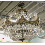 A basket type gilt metal chandelier, possibly Waterford, suspended with prismatic and other drops,