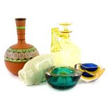 A collection of ceramic glass, to include a yellow tinted claret jug, two art glass ashtrays, a