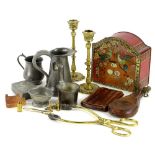 A collection of metalware, to include a pair of brass candlesticks, a Bassett tin containing a