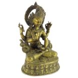 @An Indian gilt metal figure of a god in seated position.