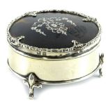 A George V silver and tortoise-shell circular trinket box, the hinged lid with piquet decoration