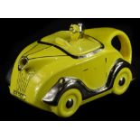 An Art Deco novelty teapot, modelled in the form of a yellow car with silver embellishment,