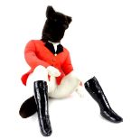 A toy model of a seated fox, wearing hunting coat, breeches and boots, 70cm H.