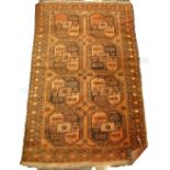 A Turkaman type rug, with two rows of four medallions, on an orange and brown ground with multiple