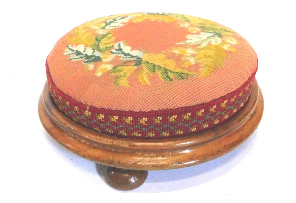 A late Victorian mahogany foot stool, with wool work seat, decorated with oak leaves and acorns,