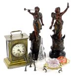 A collection of items, to include an American travelling clock in brass case, a pair of spelter