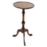 A walnut occasional table, the circular dish top with turned column and tripod base, (AF), 30cm