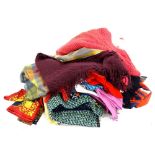 A large quantity of ladies garments, silk scarves, shawls, wool shawls etc.Provenance: Formerly