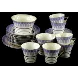 A Windsor China Art Deco part tea service, decorated with geometric designs in purple, within gilt