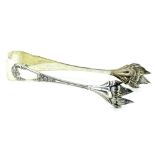 A pair of Italian white metal sugar tongs, each with embossed paw decoration and embellished with