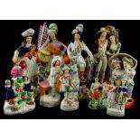 A collection of 19thC Staffordshire figures, to include Scottish ladies etc.