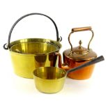 A collection of brass and copper ware, to include two preserve pans with spring handles, a brass pan