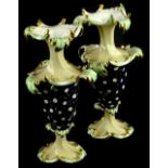 A pair of 19thC English porcelain rococo style vases, each decorated in pale green, navy etc., on