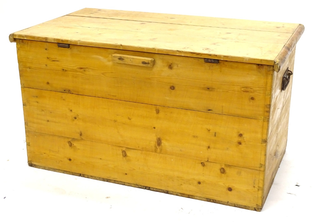 A Victorian stripped pine blanket box, with two metal handles, 86cm W.