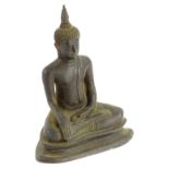 @A metal figure of an Indian god, in seated pose, with legs crossed on a stepped inverted base, 20cm