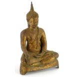 @A gilt metal Indian figure of a seated god, with eyes closed and legs crossed, on shaped base, 22cm