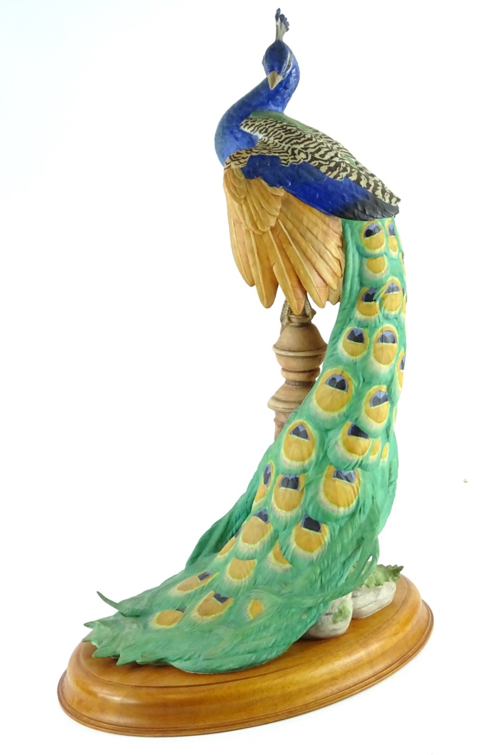 A Franklin Mint bisque porcelain figurine, The Royal Peacock, made for the Royal Society for the