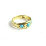 A Victorian 18ct gold turquoise ring, set with three turquoise stones, the central stone star set,