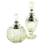 Two cut glass and silver mounted scent bottles and stoppers, the largest 20cm H.