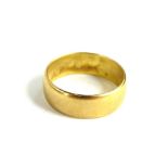 A thick 22ct gold wedding band, ring size P, maker P&W, 6.3g.