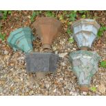 A collection of five cast iron rainwater hoppers, various designs.