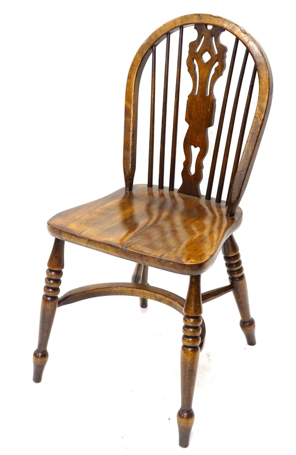 A Windsor chair, with a pierced splat, solid seat, on turned legs, with crinoline stretcher.