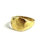 An 18ct gold gent's signet ring, with shield head bearing initials HLE?, with engraved shoulders,