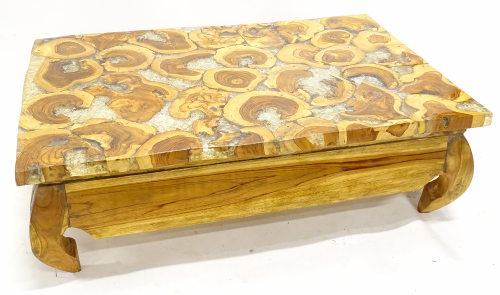 An unusual bespoke coffee table, the rectangular top made from sliced wooden timber oysters,