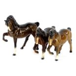 Three Beswick brown horses, each with foot raised.