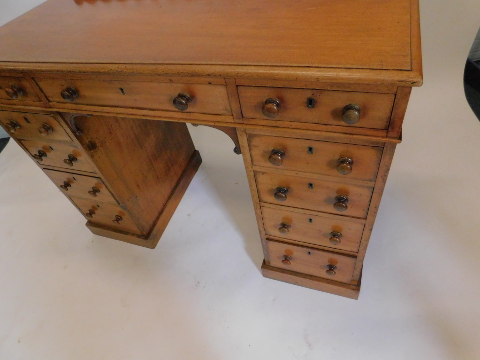 A Victorian mahogany dressing table, with a raised back, above an arrangement of eleven drawers, the - Image 2 of 2