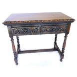 A late 19th/early 20thC carved oak side table, with a moulded edge above two frieze drawers on