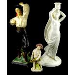 A collection of figurines, to include a Continental porcelain putto, wearing a pink hat, and a