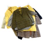 A quantity of gentleman's tweed jackets, a heavy tweed coat, a mustard coloured linen jacket etc.