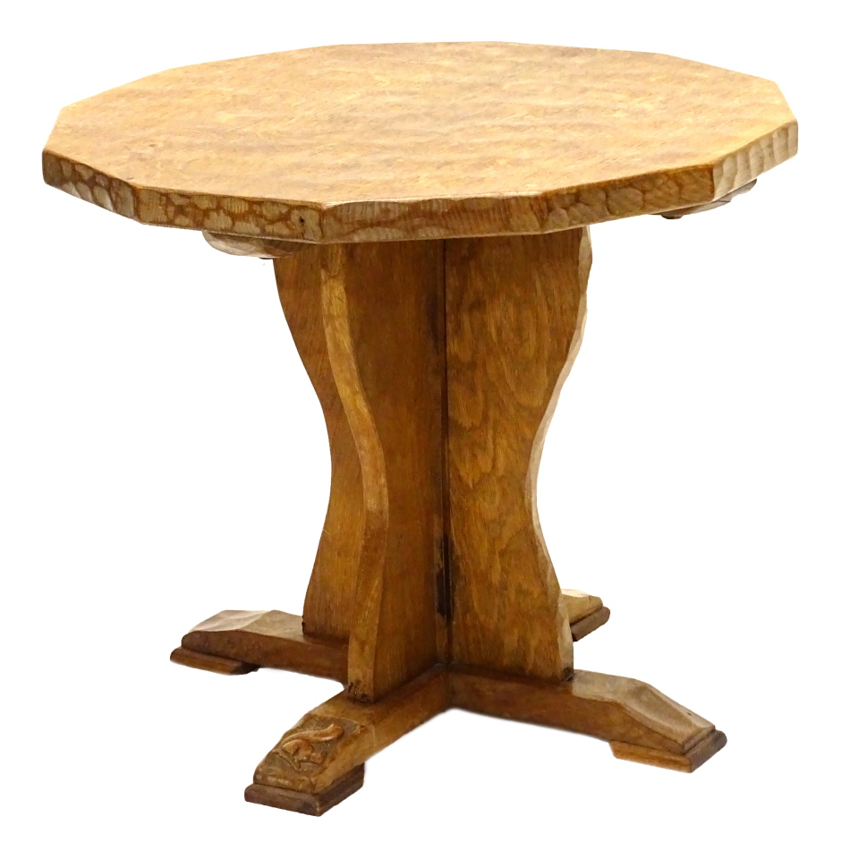 An oak occasional table by Wilf Squirrelman Hutchinson, the octagonal adzed top on trefoil