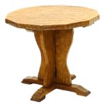 An oak occasional table by Wilf Squirrelman Hutchinson, the octagonal adzed top on trefoil