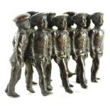 A cold painted bronze group of nine marching soldiers, in the manner of Bergman, 9cm W.