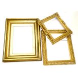 Three gilt gesso rectangular picture frames, each of differing design and size.