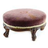 A Victorian mahogany circular foot stool, with a padded top, 21cm dia.