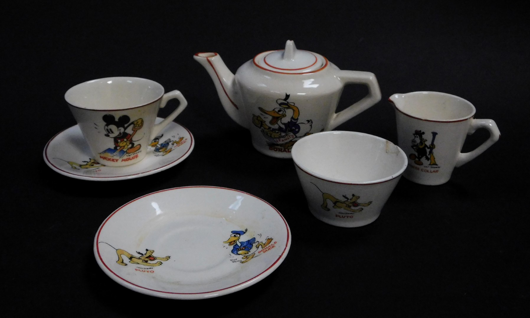An early 20thC Wade Heath for Walt Disney pottery child's part tea set, decorated with Donald