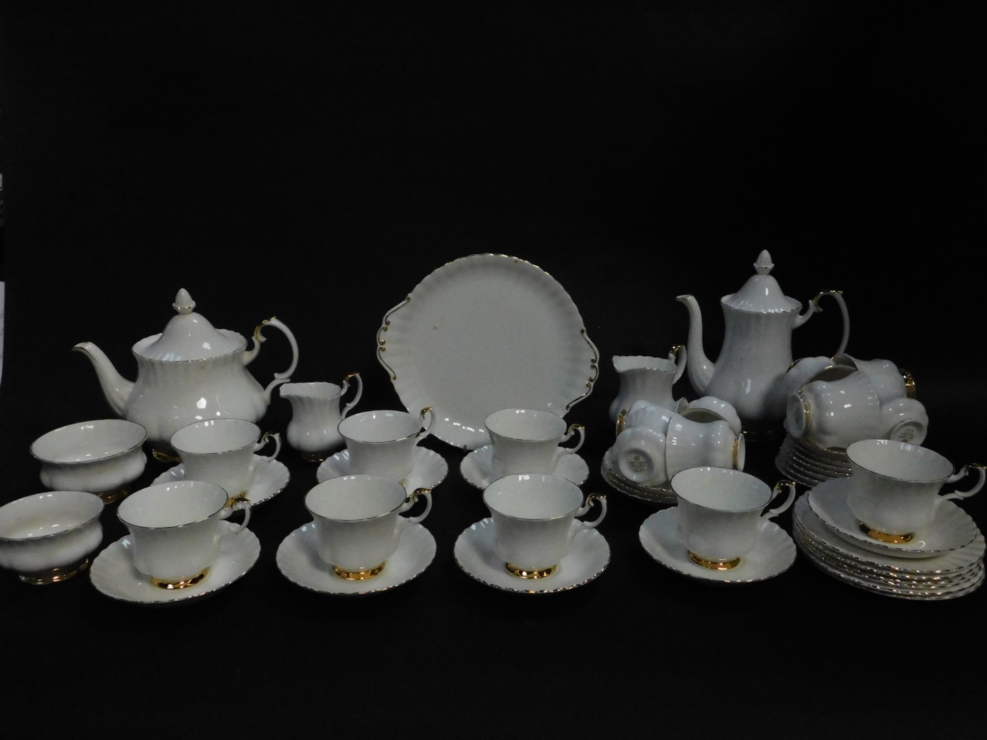 A Royal Albert porcelain part tea and coffee service decorated in the Val D'or pattern, comprising