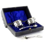 A pair of Edwardian silver open or cauldron salts, each on shaped feet (AF) and a pair of 19thC