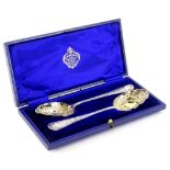 A pair of silver plated berry spoons, each with a gilt bowl, in presentation box for Alexander Clark