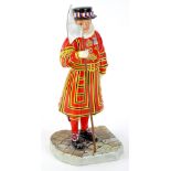 A Royal Doulton iconic London porcelain figure of a Beefeater, labelled to underside Made in