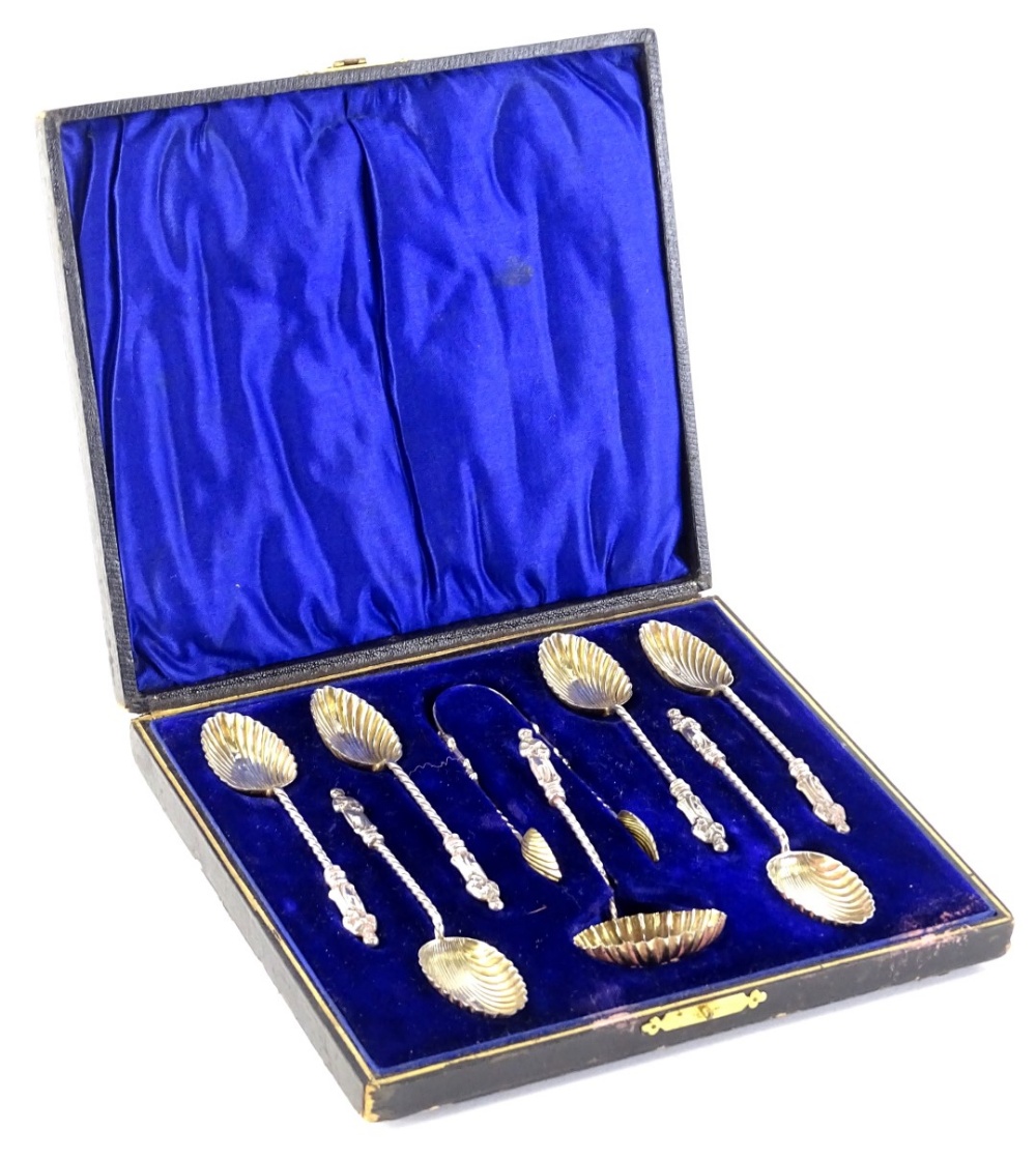 A set of six silver gilt apostle spoons, each with a shell shaped bowl and a twisted handle, a