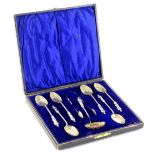 A set of six silver gilt apostle spoons, each with a shell shaped bowl and a twisted handle, a